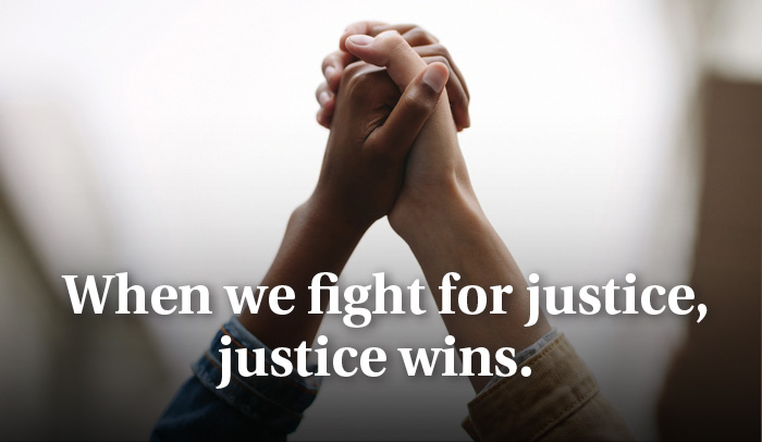 Justice Wins -hands clasping